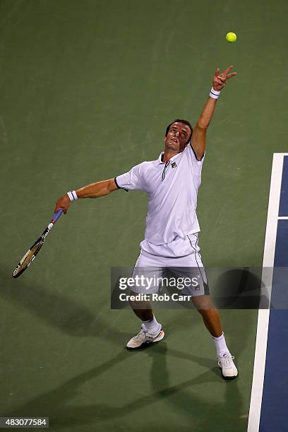 Teymuraz Gabashvili of Russia serves to Andy Murray of Great Britain during their singles match at Rock Creek Tennis Center on August 5, 2015 in...