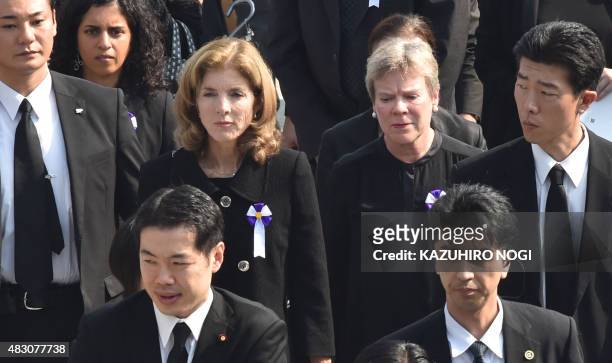 Ambassador to Japan Caroline Kennedy and under-secretary for arms control Rose Gottemoeller leave the venue after attending a memorial service to...