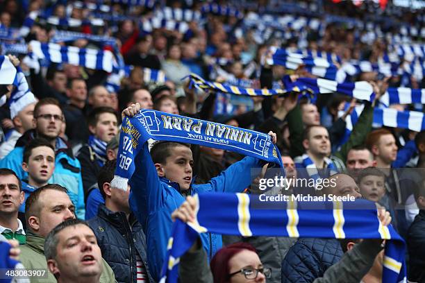 Supporters of Cardiff show their allegance to the old team colours by waving blue and white scarves during the Barclays Premier League match between...