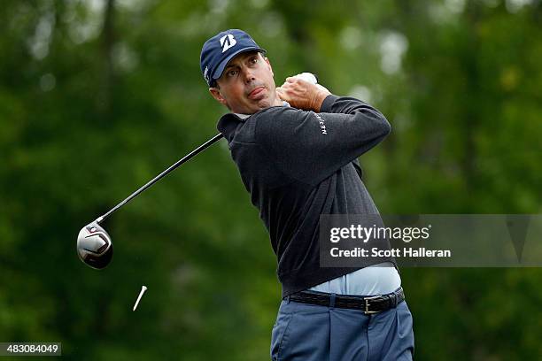 Matt Kuchar of the United States watches his tee shot on the fifteenth hole during the final round of the Shell Houston Open at the Golf Club of...