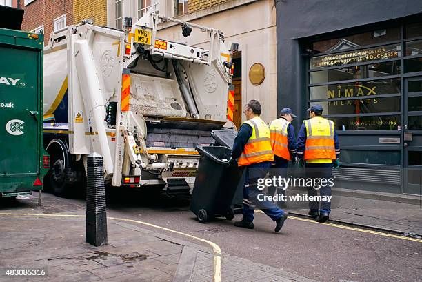 rubbish collectors working in london - dustbin lorry stock pictures, royalty-free photos & images