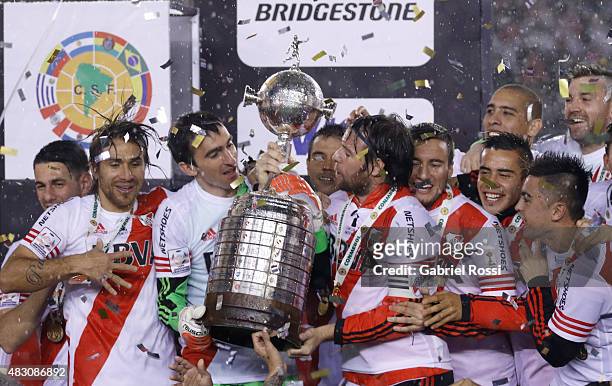 Fernando Cavenaghi of River Plate holds the trophy after winning a final match between River Plate and Tigres UANL as part of Copa Bridgestone...