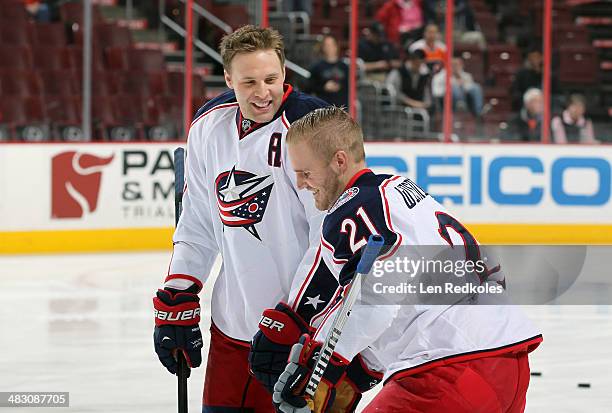 Jack Johnson and James Wisnieswki of the Columbus Blue Jackets share a laught during warm-ups prior to their game against the Philadelphia Flyers on...