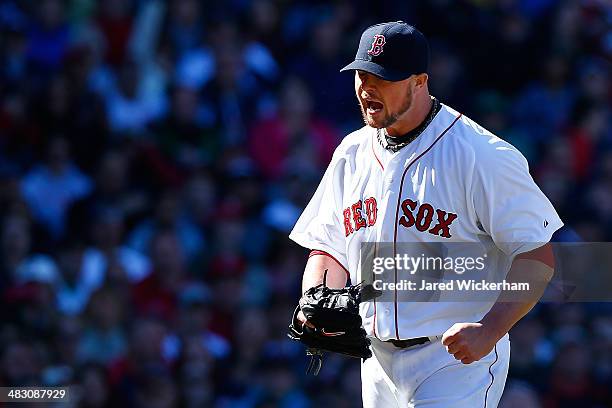 Jon Lester of the Boston Red Sox reacts after getting out of the 6th inning against the Milwaukee Brewers during the game at Fenway Park on April 6,...