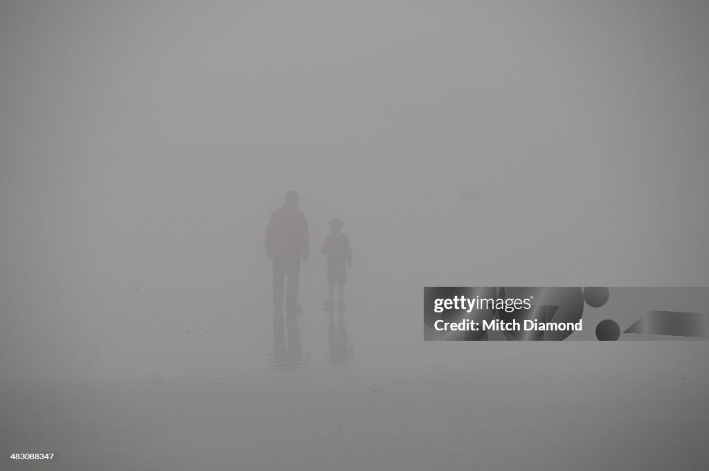 Father and son in the fog
