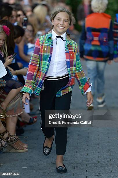 Dancer/tv personality Mackenzie Ziegler walks at Ralph Lauren Children's Fashion Show at Central Park Zoo on August 5, 2015 in New York City.