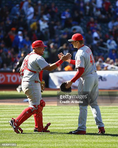 Manny Parra and Brayan Pena of the Cincinnati Reds celebrate their 2-1 win against the New York Mets on April 6, 2013 at Citi Field in the Flushing...