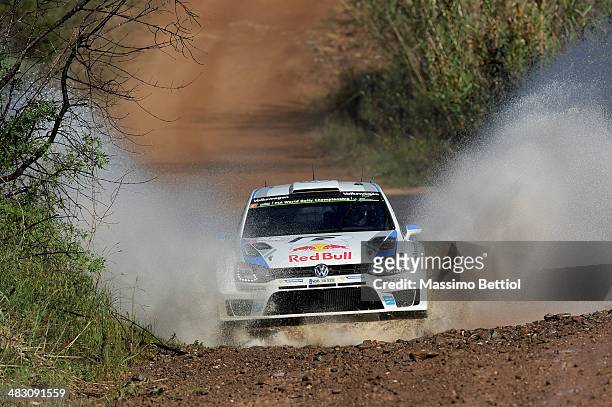 Sebastien Ogier of France and Julien Ingrassia of France compete in their Volkswagen Motorsport Polo R WRC during Day Three of the WRC Portugal on...