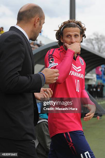 Diego Forlan of Cerezo Osaka talks with coach,Ranko Popovic in half time of the J.League match between Kashiwa Reysol and Cerezo Osaka at Hitachi...