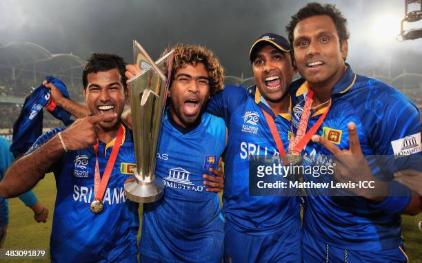 Nuwan Kulasekara, Lasith Malinga, Mahela Jayawardena and Angelo Mathews of Sri Lanka celebrate winning the World Twenty20 Final against India during...