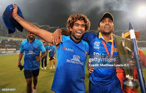 Lasith Malinga and Mahela Jayawardena of Sri Lanka celebrate their team's win over India after the ICC World Twenty20 Bangladesh 2014 Final between...