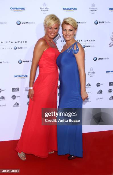 Kamilla Senjo and her sister Juliana Senjo attends the Felix Burda Award 2014 at Hotel Adlon on April 6, 2014 in Berlin, Germany.