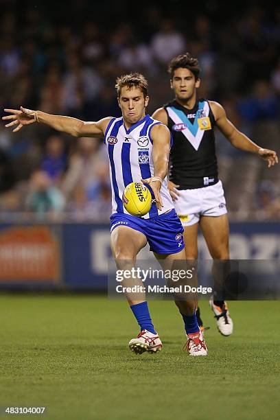 Jamie Macmillan kicks the ball during the round three AFL match between the North Melbourne Kangaroos and the Port Adelaide Power at Etihad Stadium...