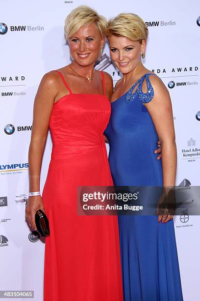 Kamilla Senjo and her sister Juliana Senjo attend the Felix Burda Award 2014 at Hotel Adlon on April 6, 2014 in Berlin, Germany.