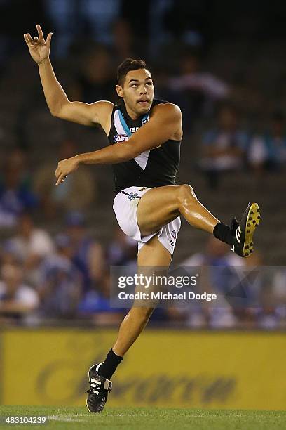 Jarman Impey of the Power kicks the ball during the round three AFL match between the North Melbourne Kangaroos and the Port Adelaide Power at Etihad...