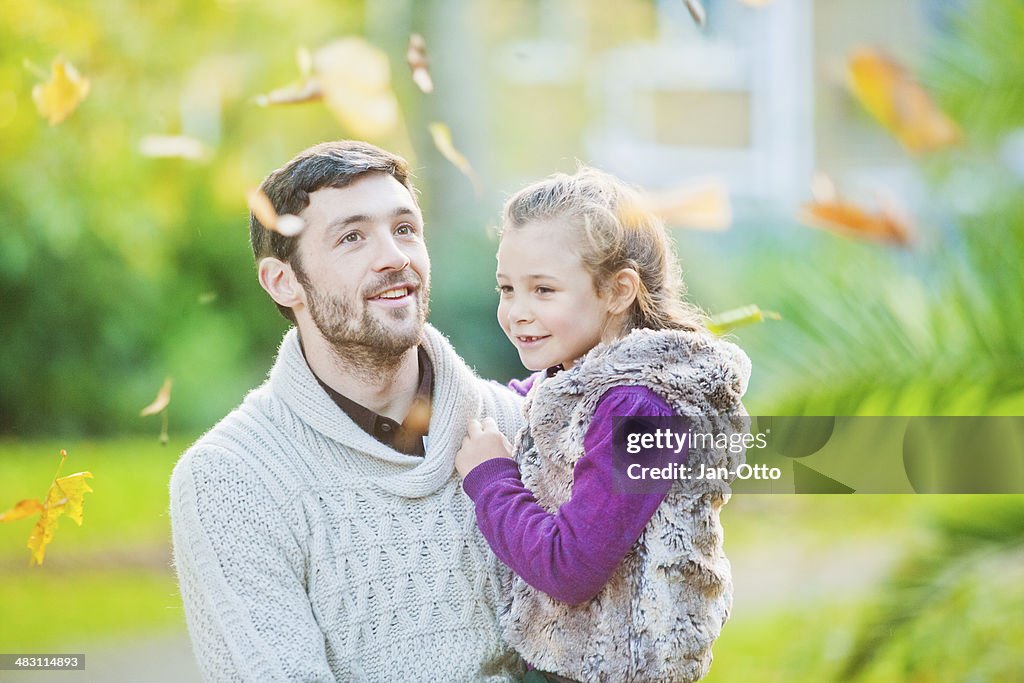 Father and daughter having fun in a London`s park
