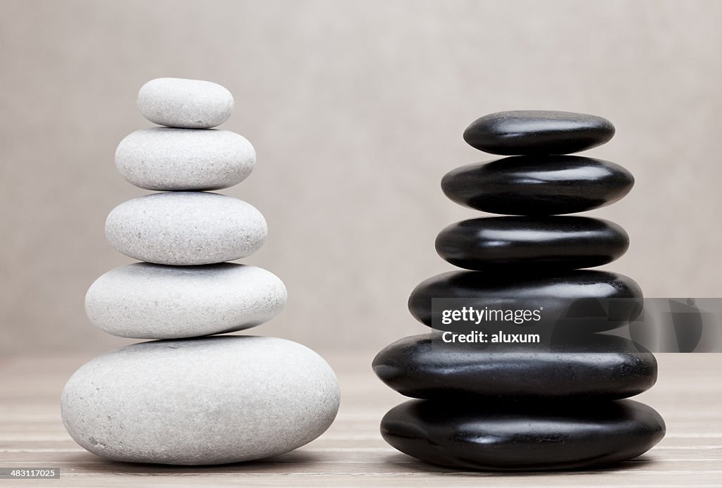 Grey and black piled pebble stones
