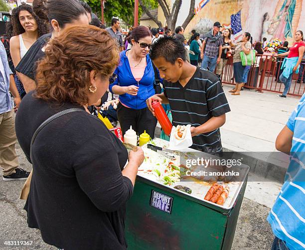 selling hot dogs during cinco de mayo celebration, la - mexican american stock pictures, royalty-free photos & images