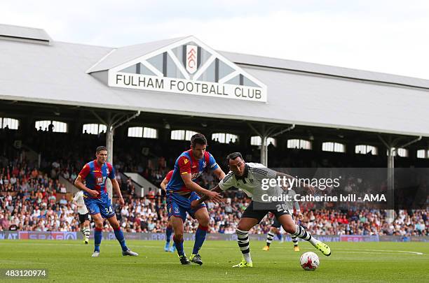 Scott Dann of Crystal Palace and Konstantinos Mitroglou of Fulham in action during the pre-season friendly between Fulham and Watford at Craven...