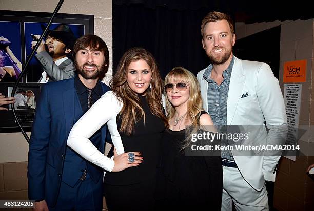 Singer Stevie Nicks poses with musicians Dave Haywood, Hillary Scott and Charles Kelley of Lady Antebellum at the 49th Annual Academy of Country...