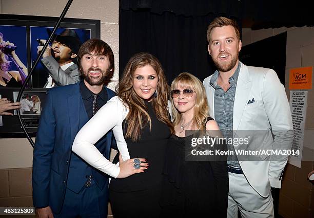 Singer Stevie Nicks poses with musicians Dave Haywood, Hillary Scott and Charles Kelley of Lady Antebellum at the 49th Annual Academy of Country...
