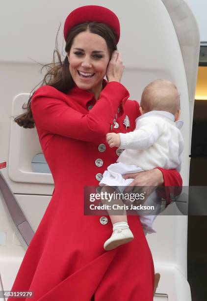 Catherine, Duchess of Cambridge, Prince William, Duke of Cambridge and Prince George of Cambridge arrive at Wellington Military Terminal on an RNZAF...