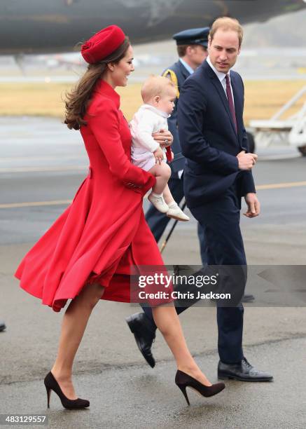 Catherine, Duchess of Cambridge, Prince William, Duke of Cambridge and Prince George of Cambridge arrive at Wellington Military Terminal on an RNZAF...