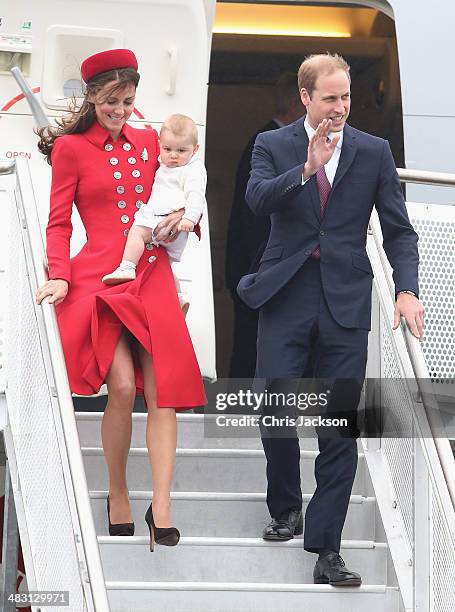 Catherine, Duchess of Cambridge, Prince William, Duke of Cambridge and Prince George of Cambridge arrive at Wellington Military Terminal on an RNZAF...