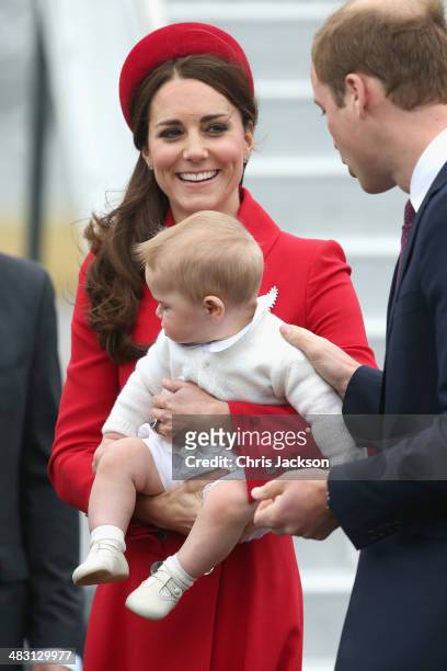 Catherine, Duchess of Cambridge, Prince William, Duke of Cambridge and Prince George of Cambridge arrive at Wellington Military Terminal on an RNZAF...