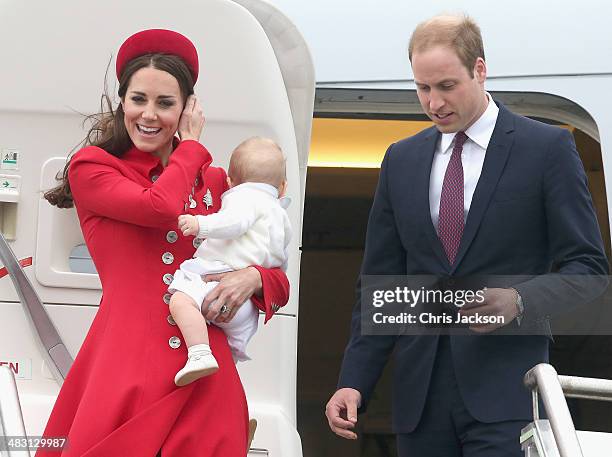 Catherine, Duchess of Cambridge, Prince William, Duke of Cambridge and Prince George of Cambridge arrive at Wellington Military Terminal on an RNZAF...