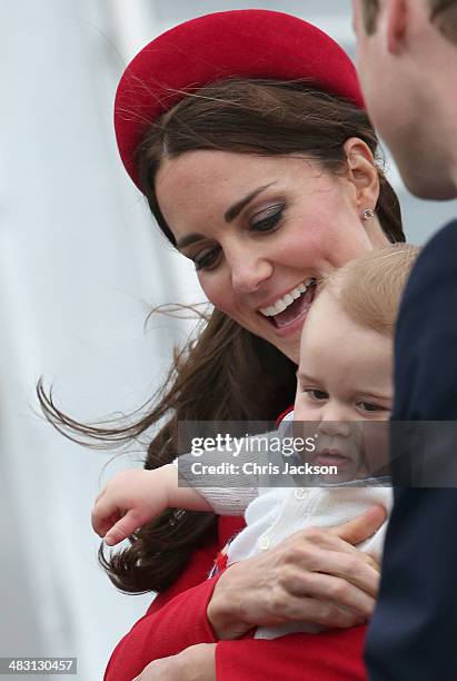 Catherine, Duchess of Cambridge, Prince William, Duke of Cambridge and Prince George of Cambridge arrive at Wellington Military Terminal on an RNZAF...