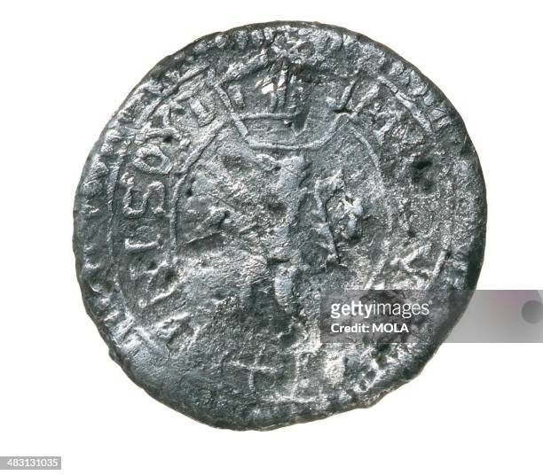 English lead token from c 1570s1590s depicting a crowned lion within Garter ; found at the Rose playhouse, and would have been used by those who...