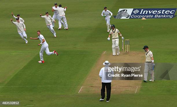 Stuart Broad of England celebrates after taking the wicket of Michael Clarke of Australia during day one of the 4th Investec Ashes Test match between...
