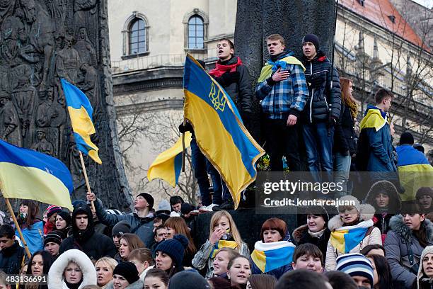 ukrainian students singing national anthem during pro eu demonstrations - ukrainian stock pictures, royalty-free photos & images