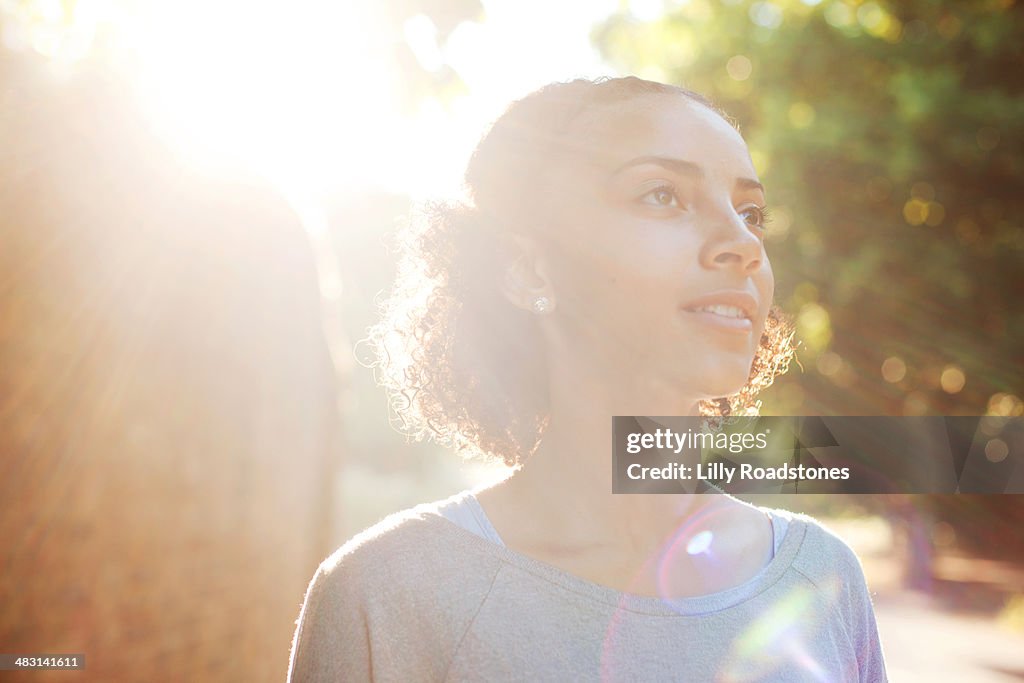 Young woman dreaming in the sun