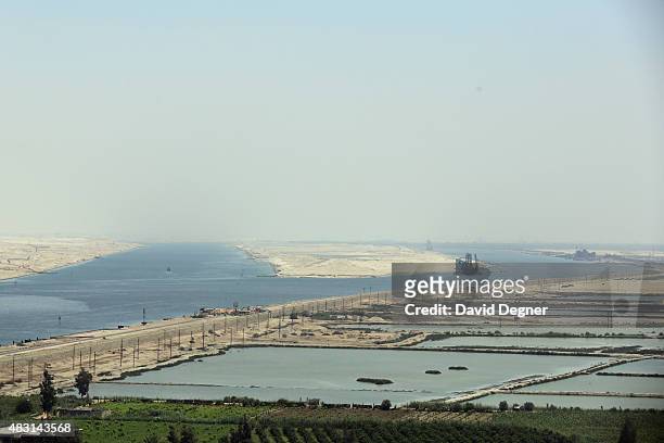 View of two channels of the Suez Canal during the opening ceremony of the new Suez Canal expansion including a new 35km channel on August 6, 2015 in...