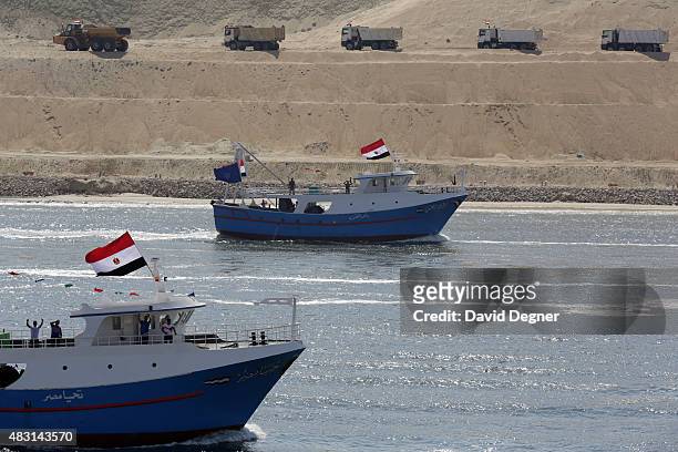 Boats cross the Suez Canal during the opening ceremony of the new Suez Canal expansion including a new 35km channel on August 6, 2015 in Suez, Egypt....