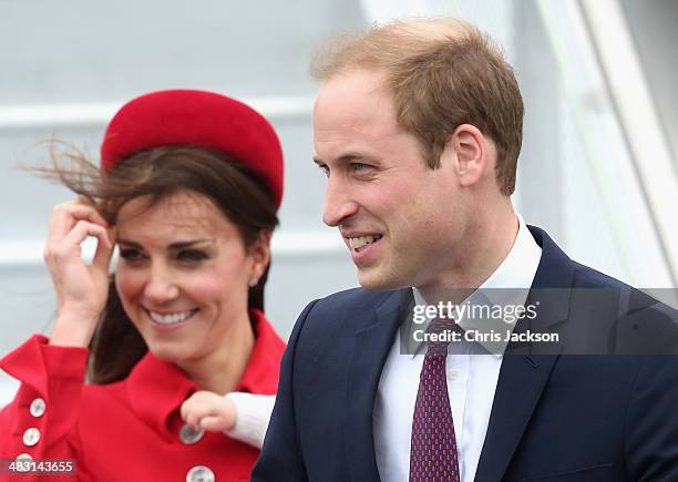 Catherine, Duchess of Cambridge, Prince William, Duke of Cambridge and Prince George of Cambridge arrive at Wellington Military Terminal on an RNZAF...