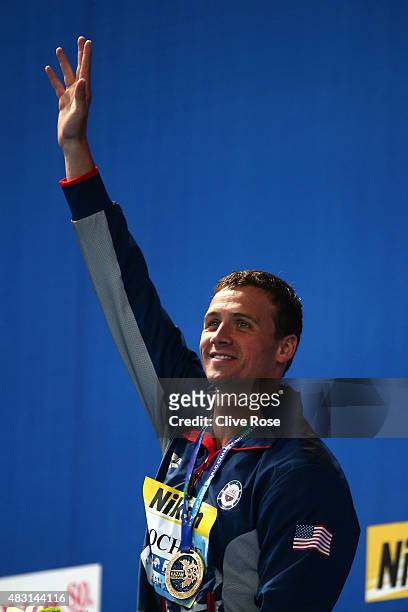 Gold medalist Ryan Lochte of the United States poses during the medal ceremony for the Men's 200m Individual Medley Final on day thirteen of the 16th...