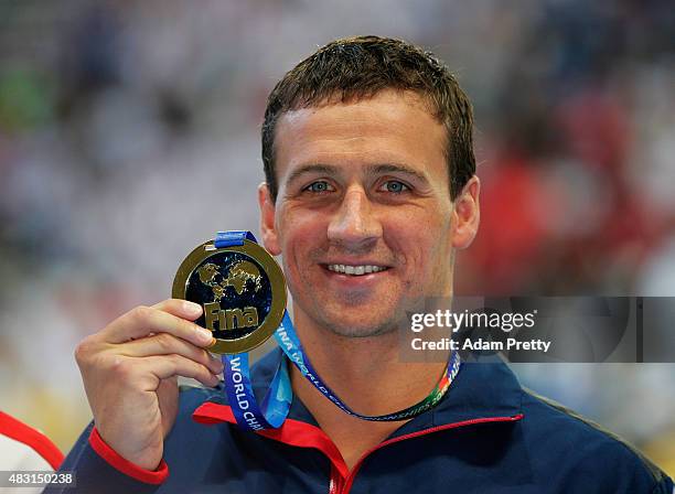 Gold medalist Ryan Lochte of the United States poses during the medal ceremony for the Men's 200m Individual Medley Final on day thirteen of the 16th...