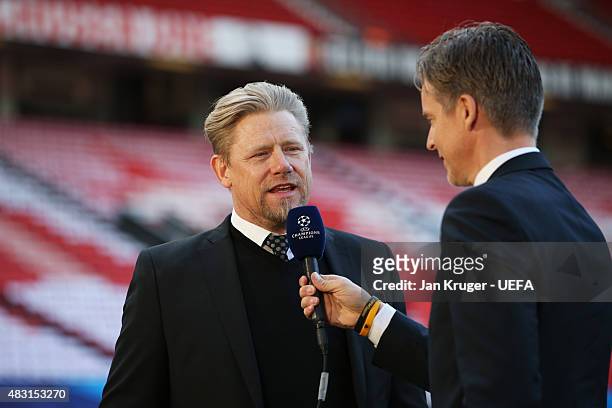 Former Manchester United goalkeeper Peter Schmeichel is interviews prior to the UEFA Champions League Quarter Final first leg match between...
