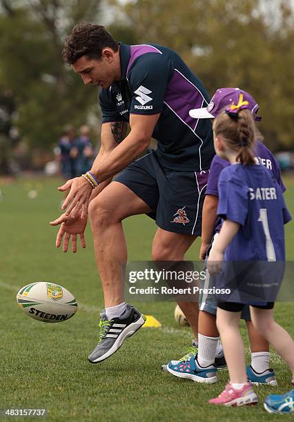 Billy Slater gives instructions to fans during the Melbourne Storm Billy's Buddies school holiday clinic launch at Gosch's Paddock on April 7, 2014...