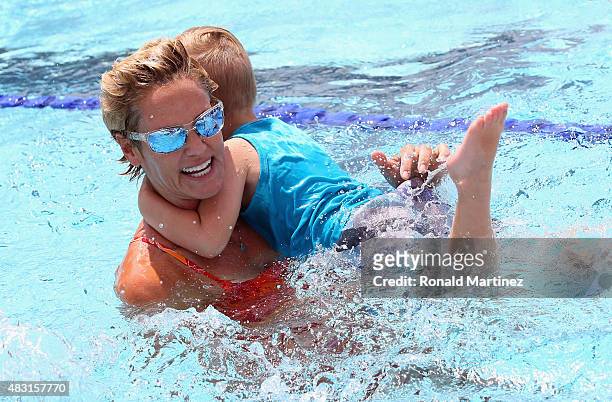 Time Olympic medalist for swimming, Dara Torres teaches children the benefits of team swimming for SwimToday during the 2015 Phillips 66 National...