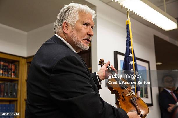 Phillip Injeian, a violin expert, explains the distinguisable markings that helped him identify Roman Totenberg's stolen Stadivarius violin, which...