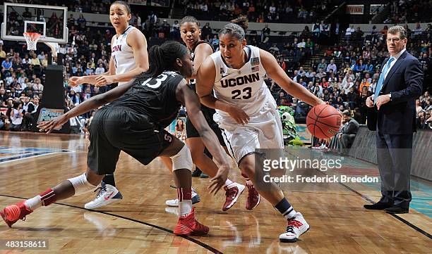 Brianna Banks of the Connecticut Huskies drives against Chiney Ogqumike of the Stanford Cardinal at Bridgestone Arena on April 6, 2014 in Nashville,...