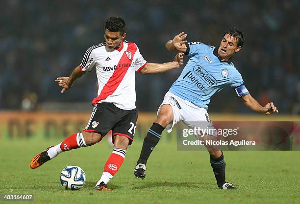 Teofilo Gutierrez of River Plate, fights for the ball with Guillermo Farre of Belgrano during a match between Belgrano and River Plate as part of...