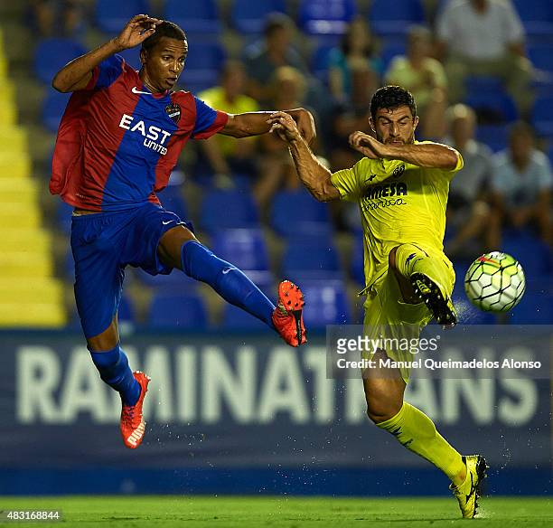 Deyverson of Levante and Bojan Jokic of Villarreal battle for the ball during a Pre Season Friendly match between Levante UD and Villarreal CF at...