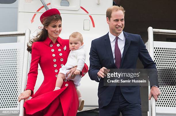 Prince William, Duke of Cambridge, Catherine, Duchess of Cambridge and Prince George of Cambridge arrive at Wellington Airport's military terminal...