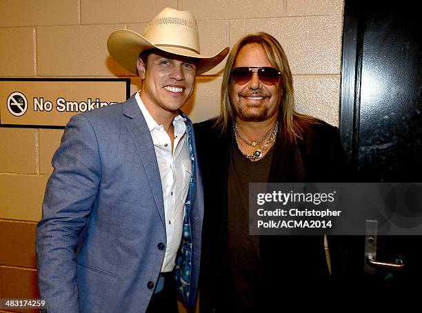 Recording artist Dustin Lynch and Vince Neil attend the 49th Annual Academy of Country Music Awards at the MGM Grand Garden Arena on April 6, 2014 in...