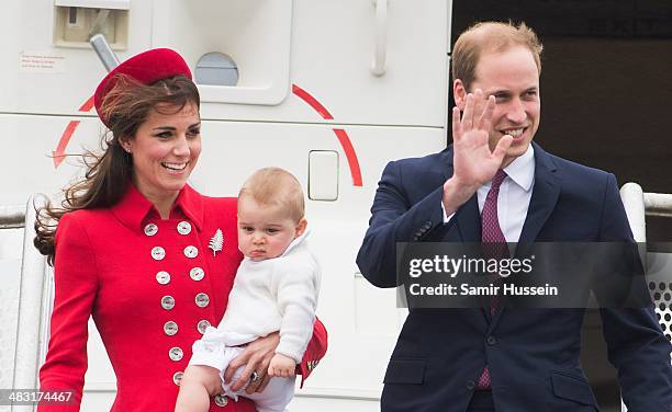 Prince William, Duke of Cambridge, Catherine, Duchess of Cambridge and Prince George of Cambridge arrive at Wellington Airport's military terminal...